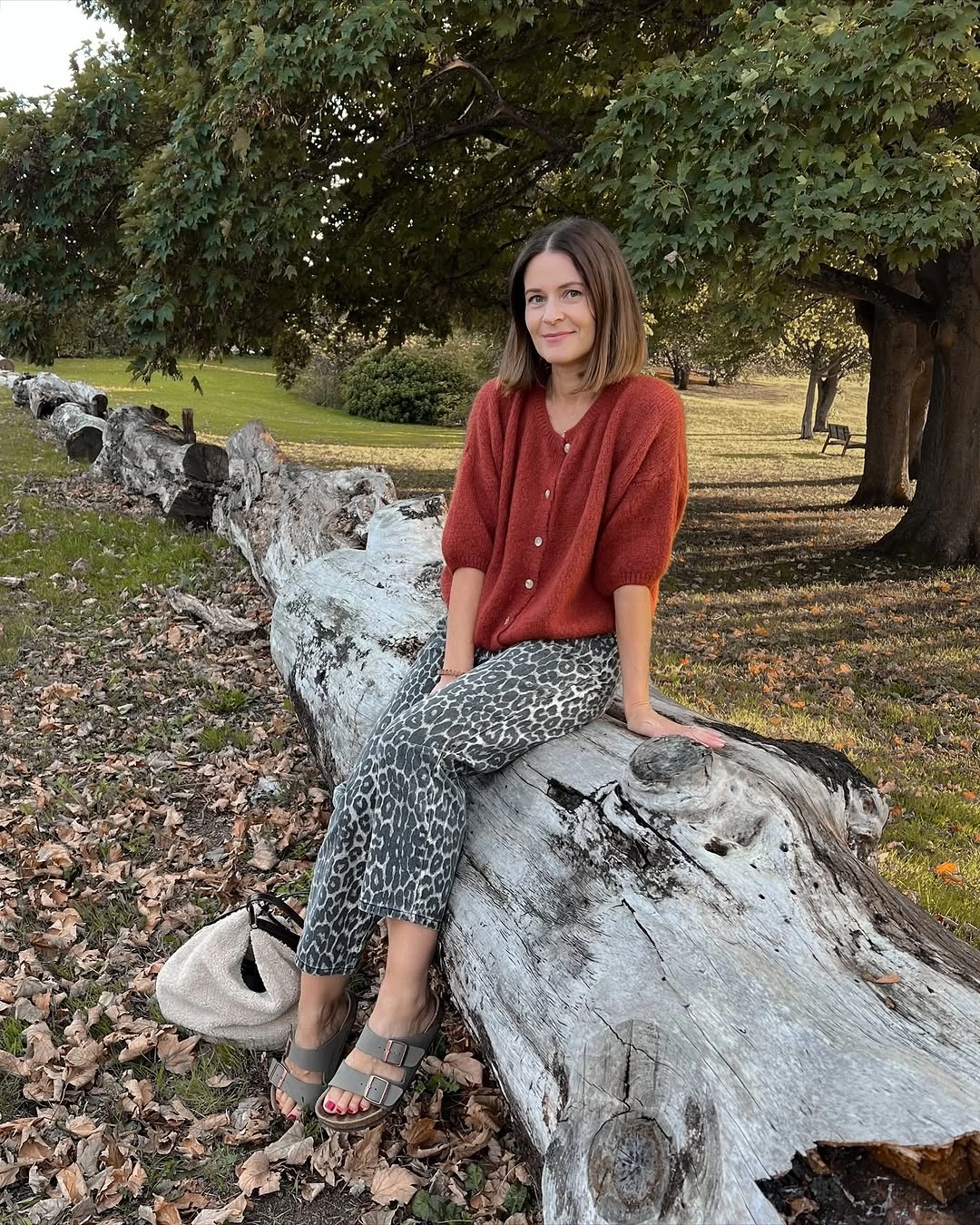Rust cardigan with leopard trousers and off-white tote