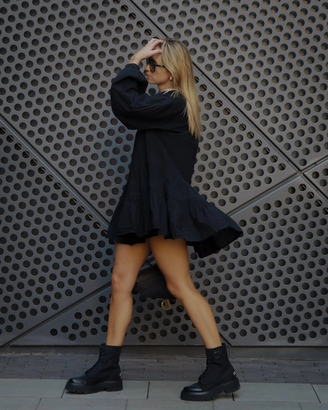 Loose black mini dress with sturdy lace-up ankle boots