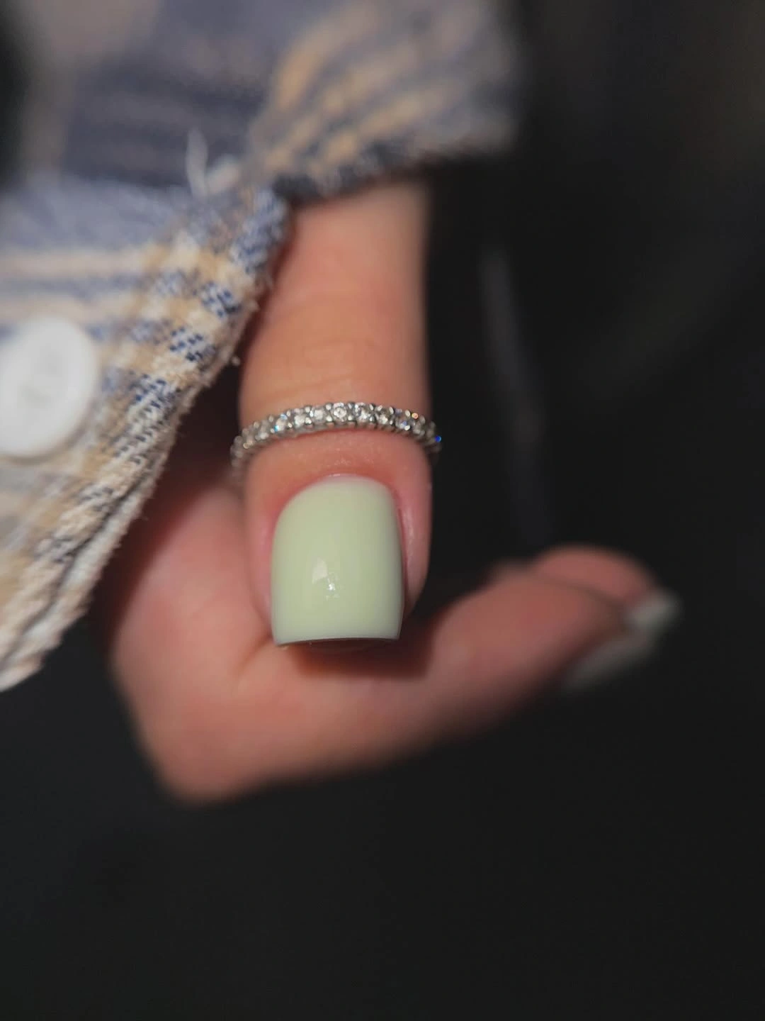 Pale mint short rounded-square nails beside gray knitwear
