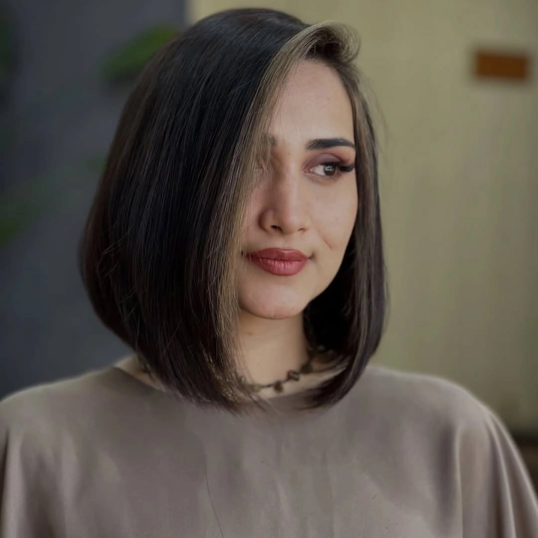 Dark side-parted bob with rounded face-side fullness