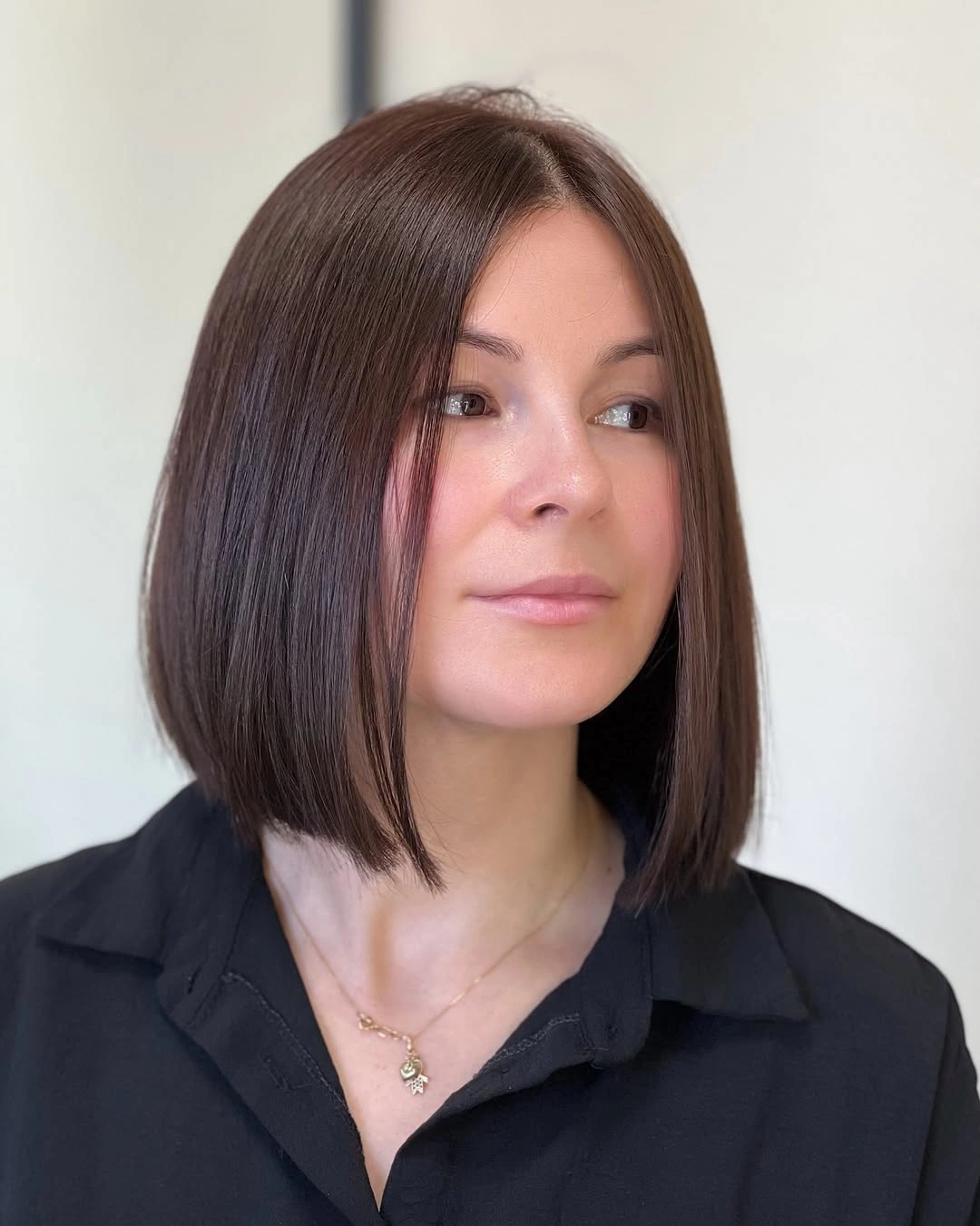 Smooth medium brown bob with softly angled face panels