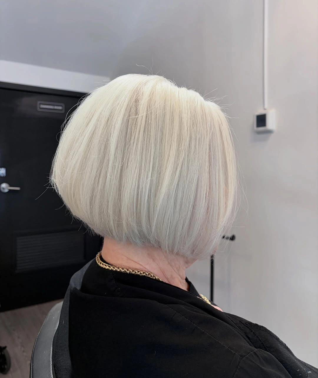 Pale platinum stacked bob with rounded back and tucked nape