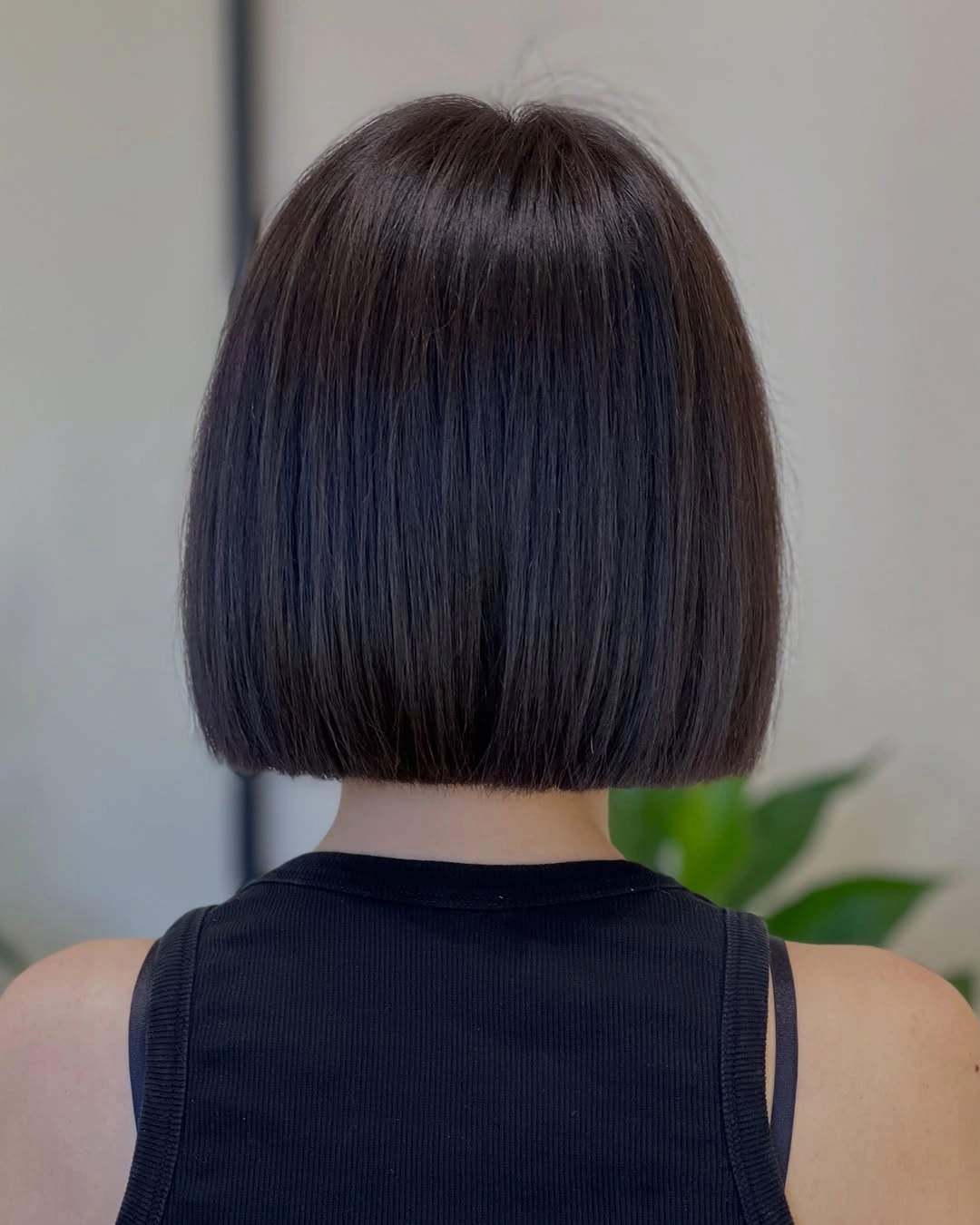 Dark brown blunt bob with smooth rounded back edge