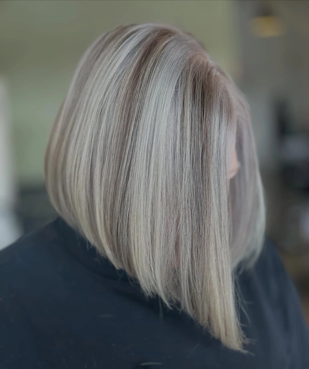 Pale blonde angled bob with fine darker vertical strands