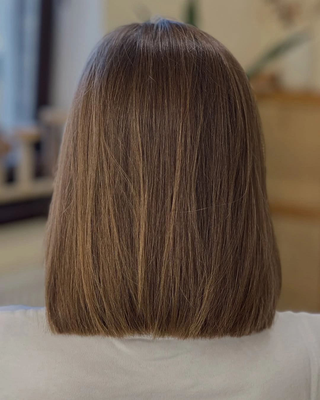 Straight medium brown bob with even back edge