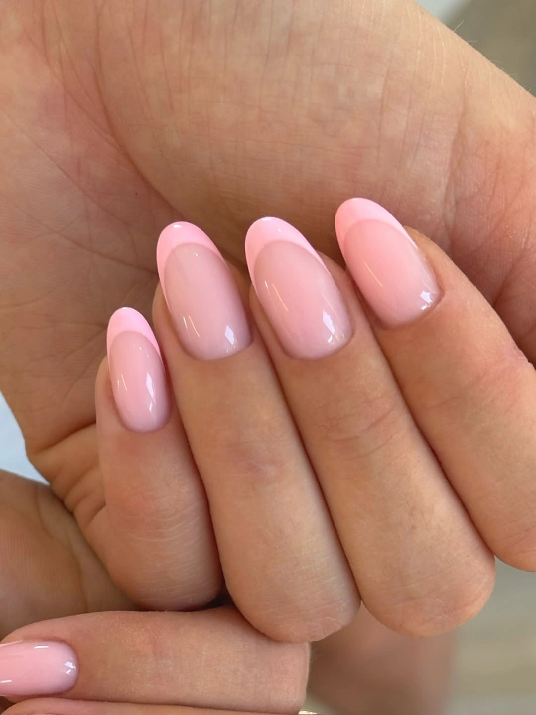 Milky pink almond nails with soft light pink French tips