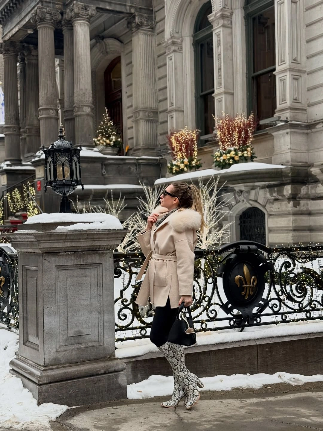 Light beige textured-collar coat with dark tights and patterned boots