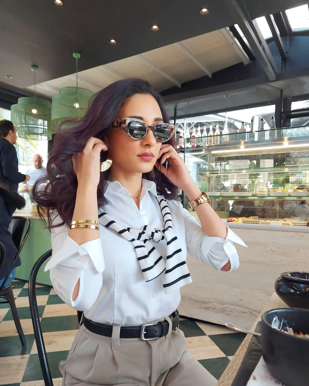 White shirt striped scarf with beige trousers and belt