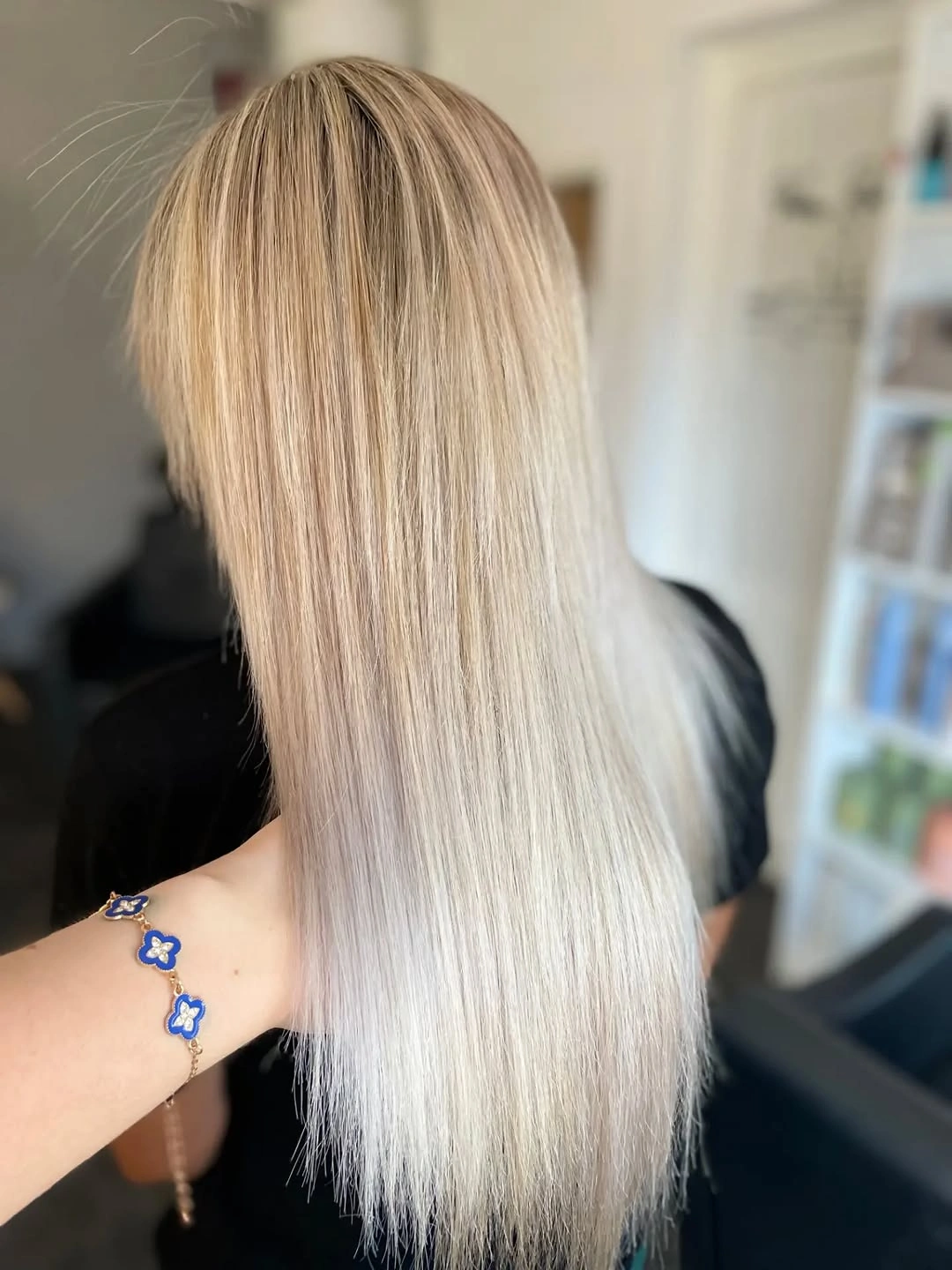 Very long straight blonde hair with beige roots and pale ends