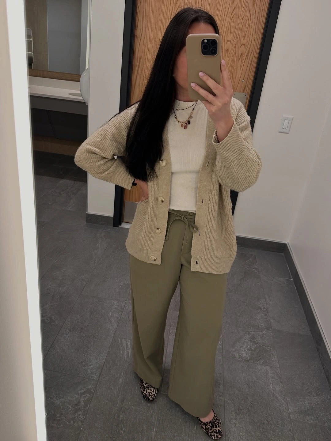 Cream cardigan white top olive trousers and patterned pointed shoes