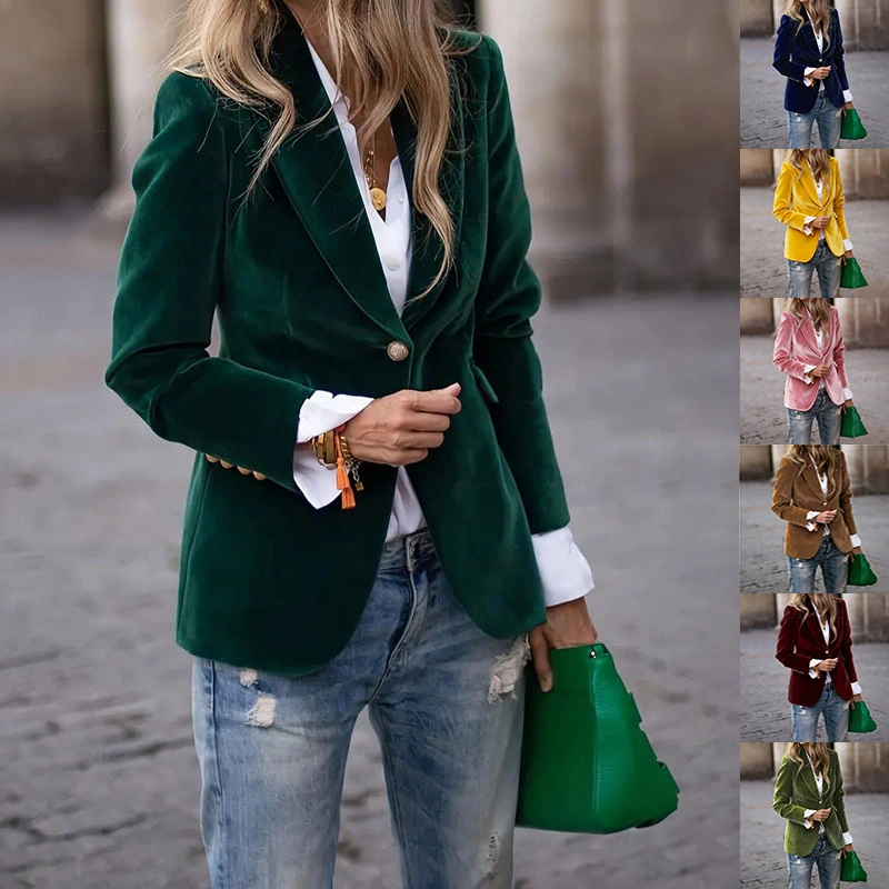 Emerald blazer white shirt blue jeans and green handbag