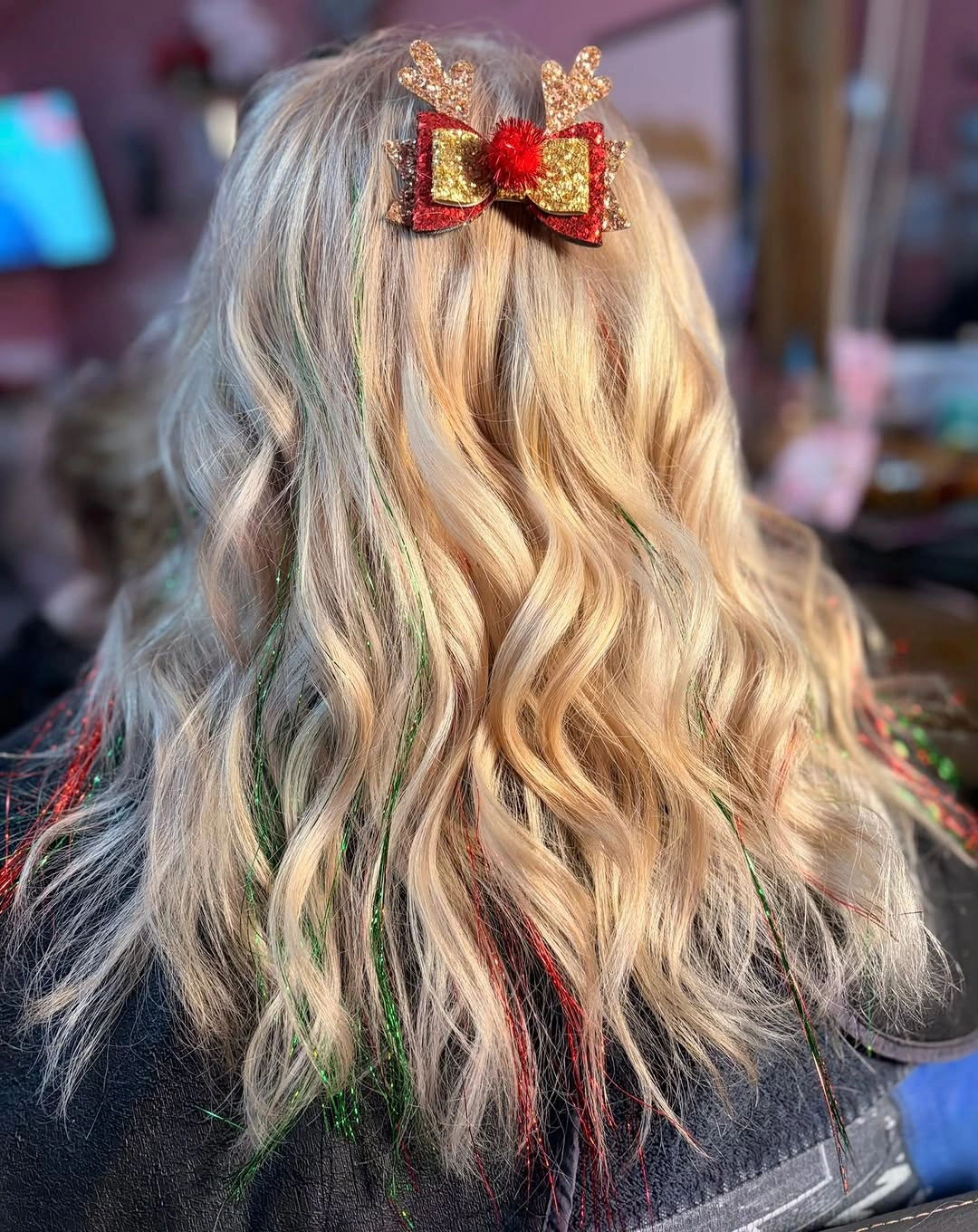 Blonde waves with festive bow clip and colored shiny strands