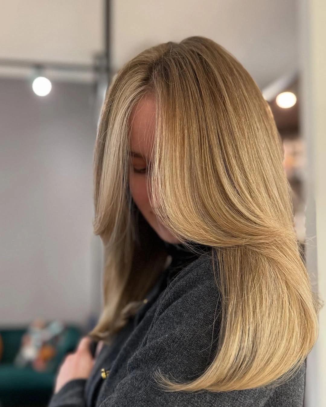 Long blonde hair with smooth lengths and curved ends
