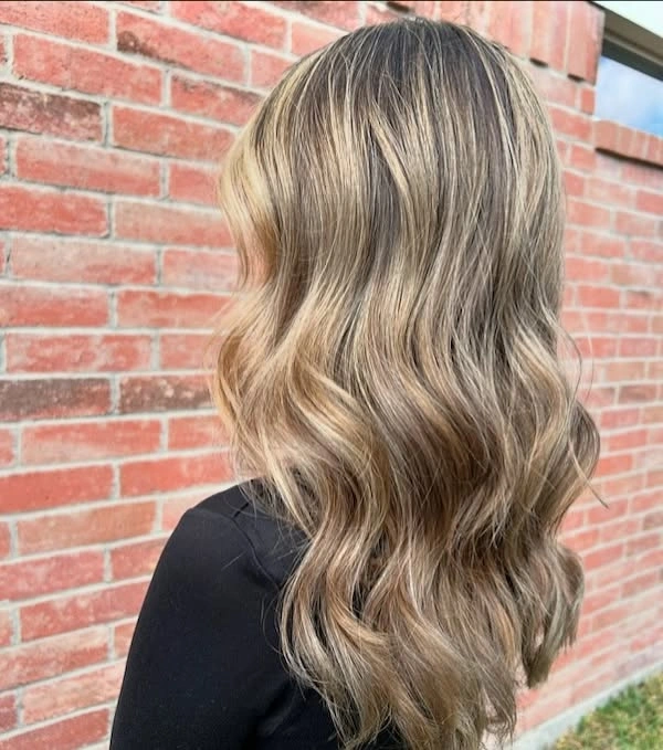 Long dark blonde hair with varied loose waves