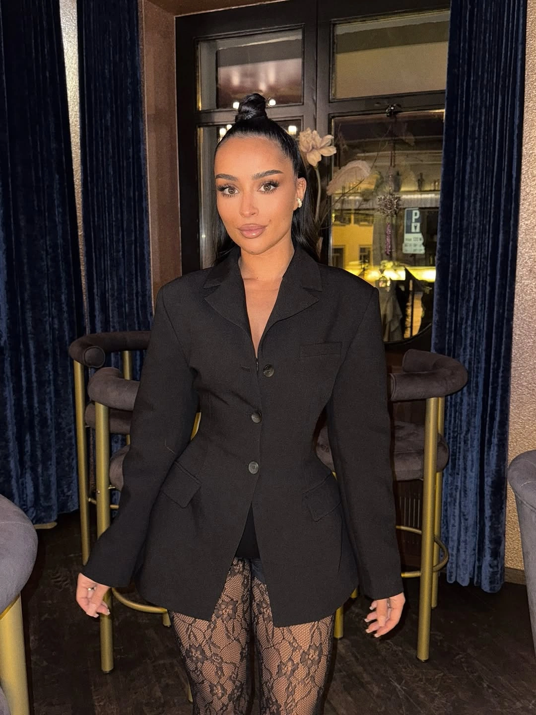 Shaped black blazer with sheer floral lace legwear