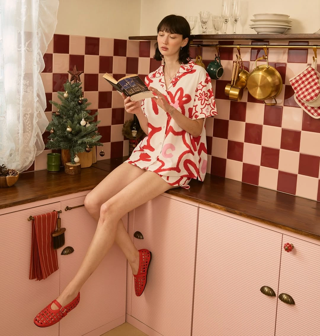 White printed shirt and shorts with red flat shoes