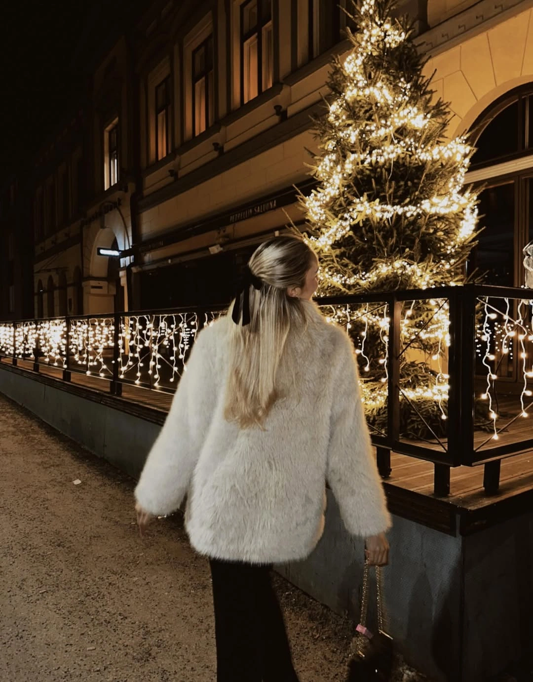 White shaggy jacket with black trousers and hair ribbon