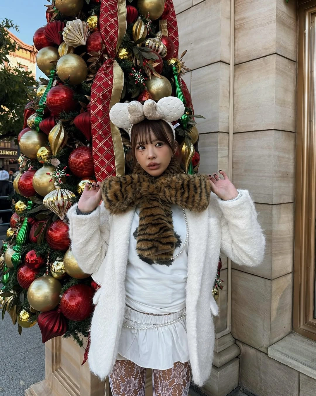 White layered outfit with patterned tights and dark scarf