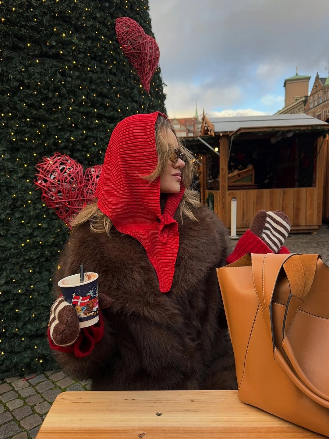 Brown shaggy outer layer with red hood scarf and mittens
