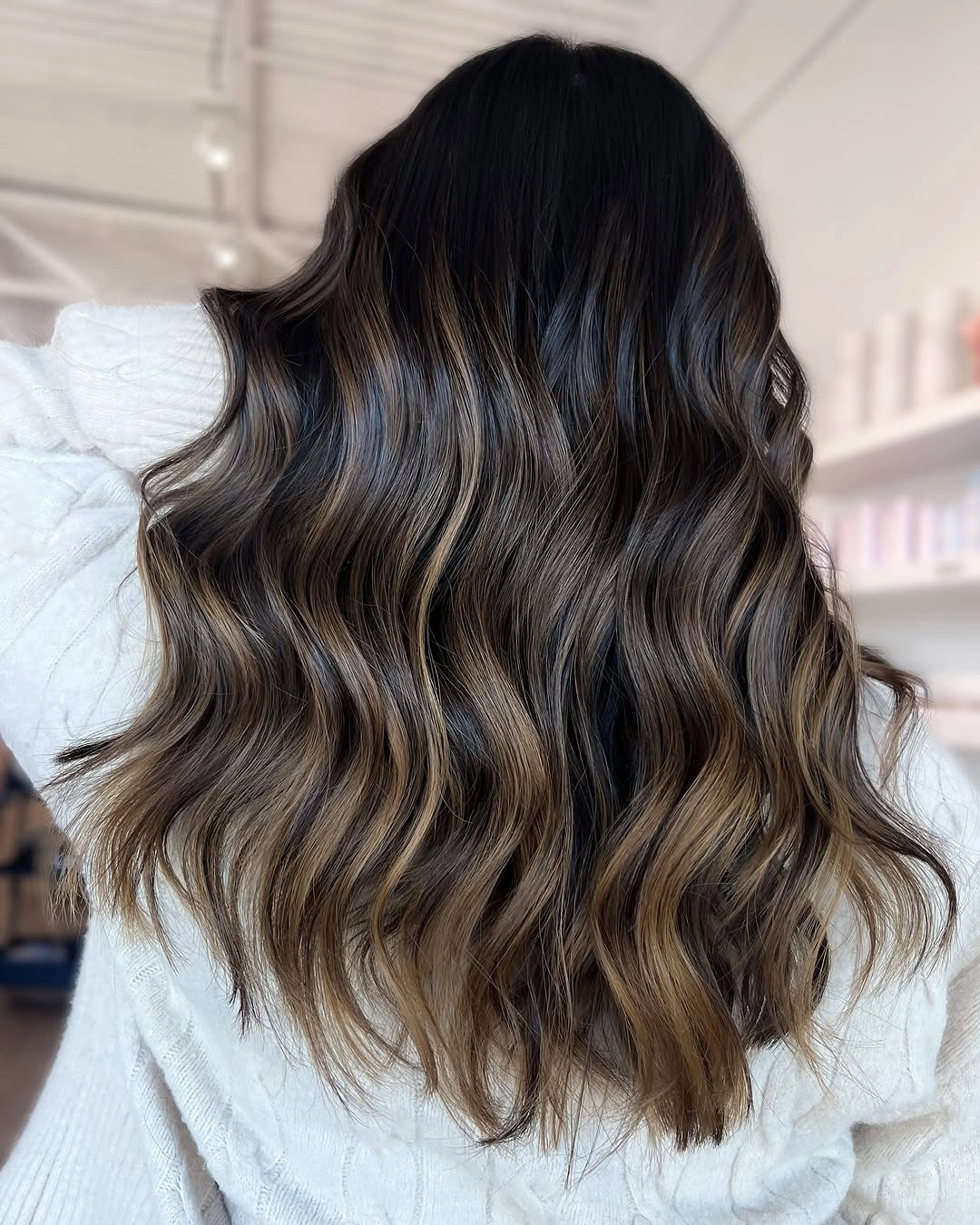 Back view of brunette waves with smoky beige ribbons