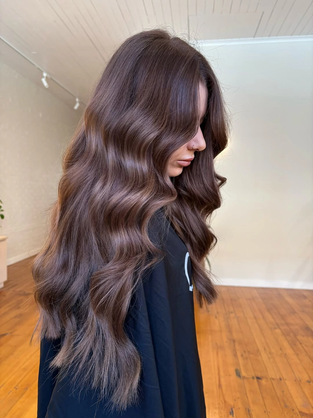 Very long smoky brunette waves with cool taupe shine