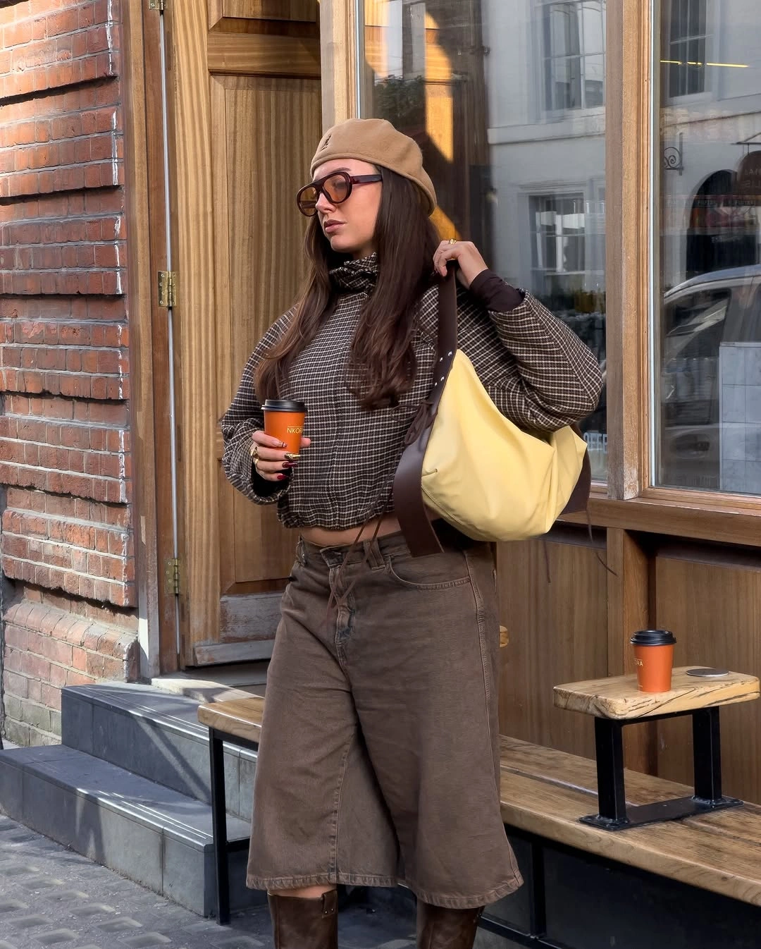 Brown plaid jacket with knee-length shorts, beret, and yellow bag