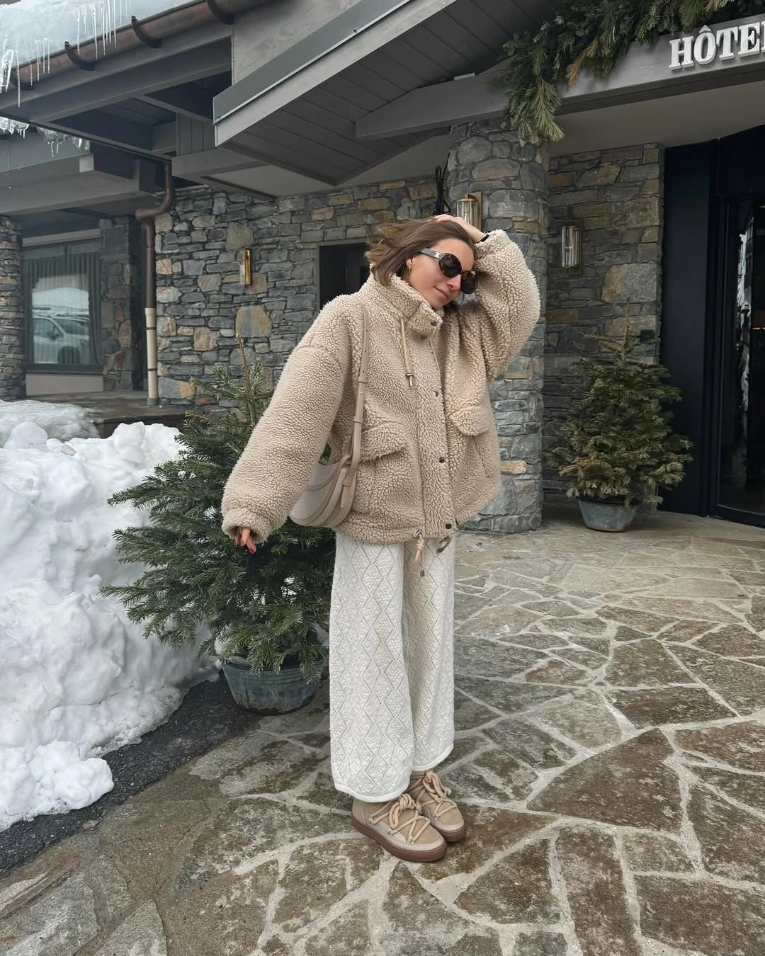Cream fleece jacket with a long light patterned bottom and light-brown footwear