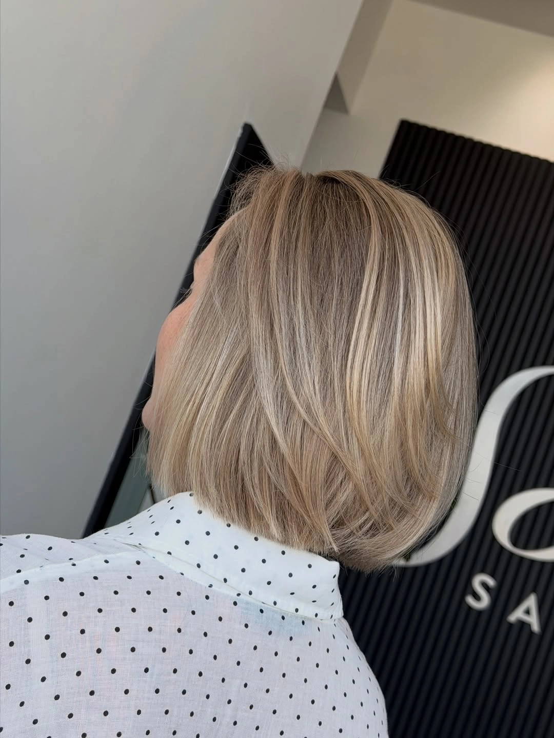 Blonde neck-length bob with rounded back shape