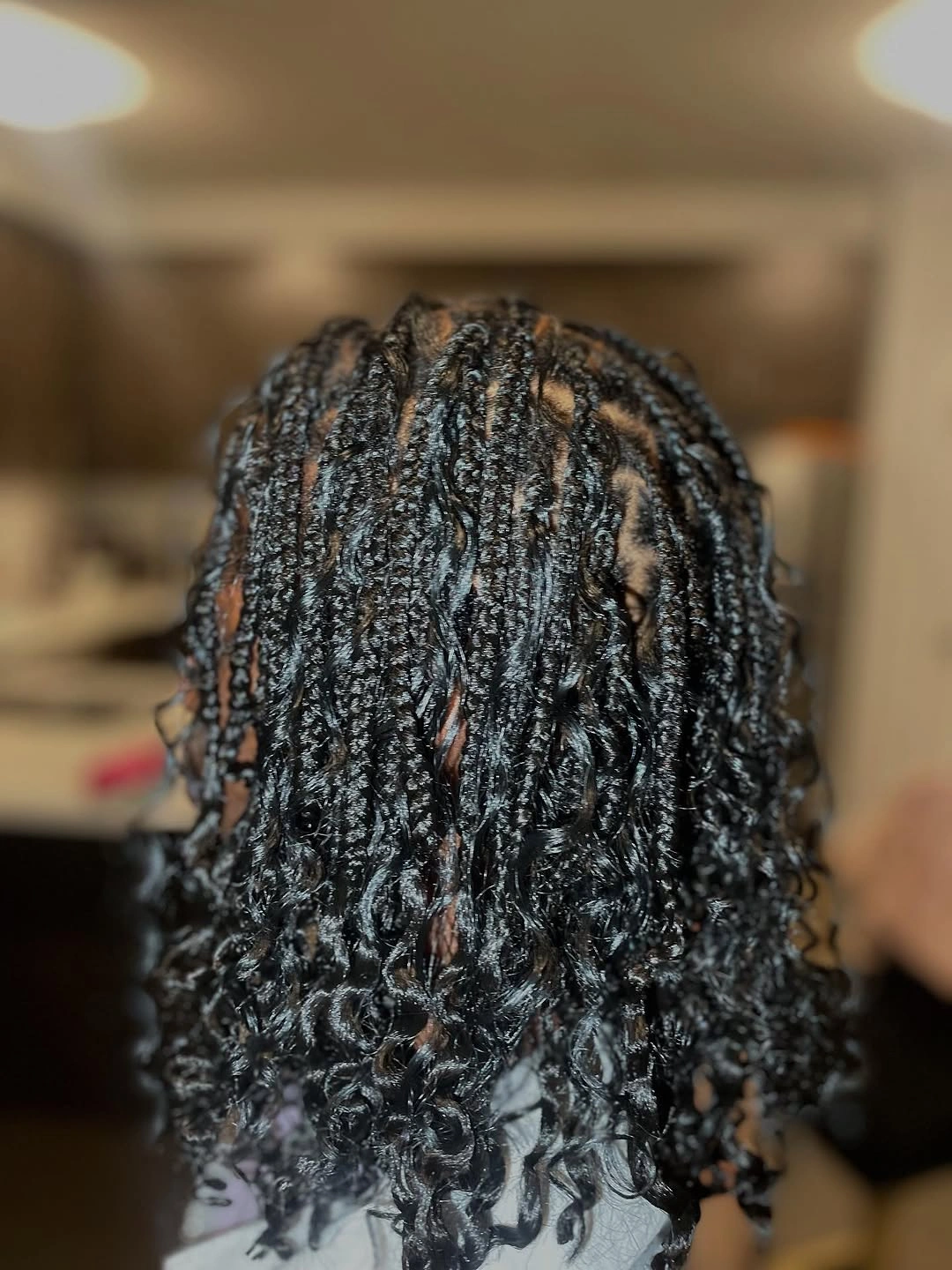 Medium dark curls with glossy wet-looking definition