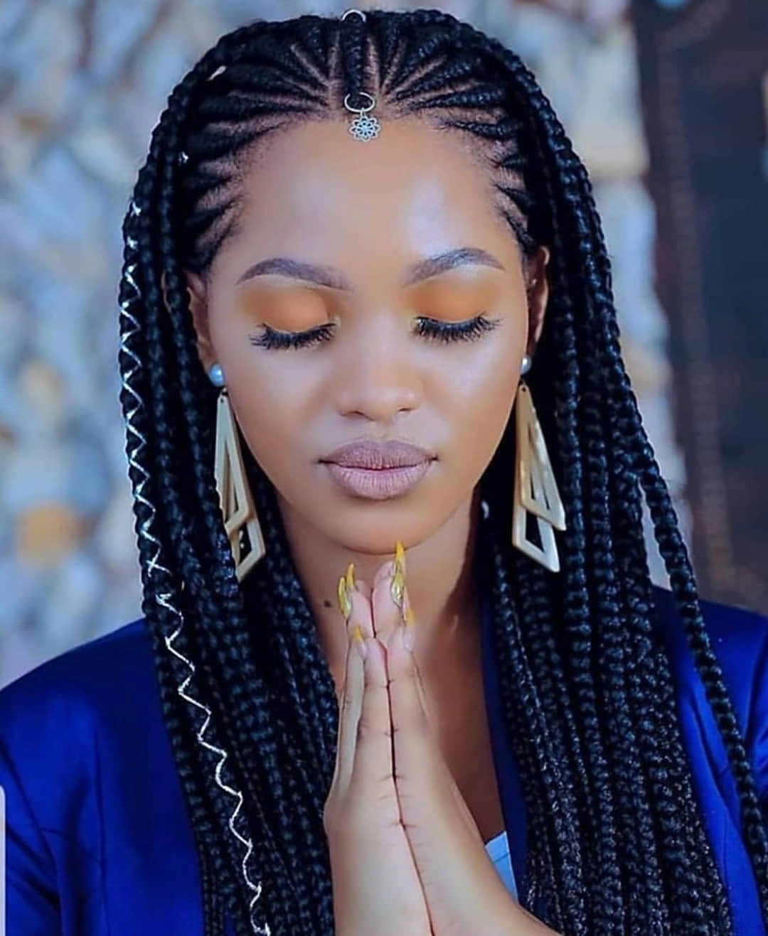 Long braids gathered half-up with straight lengths below