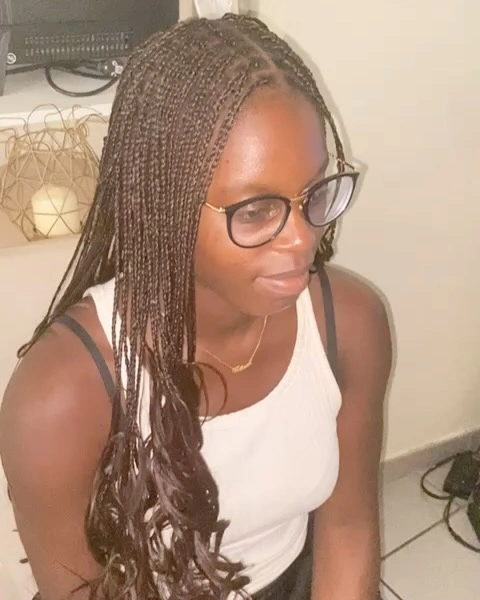 Long thin brown braids with loose curly ends