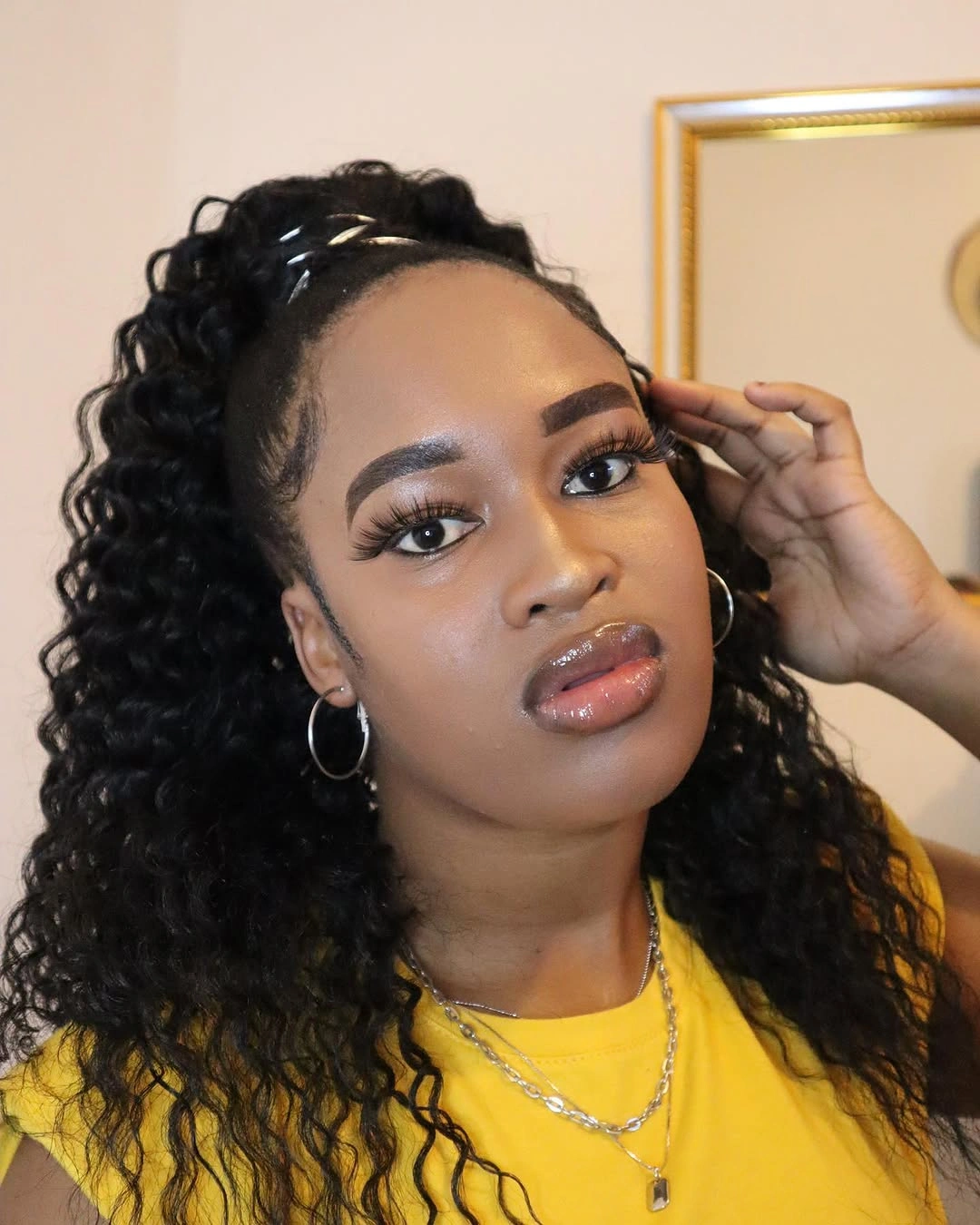 Curly-looking half-up hair with braided crown detail