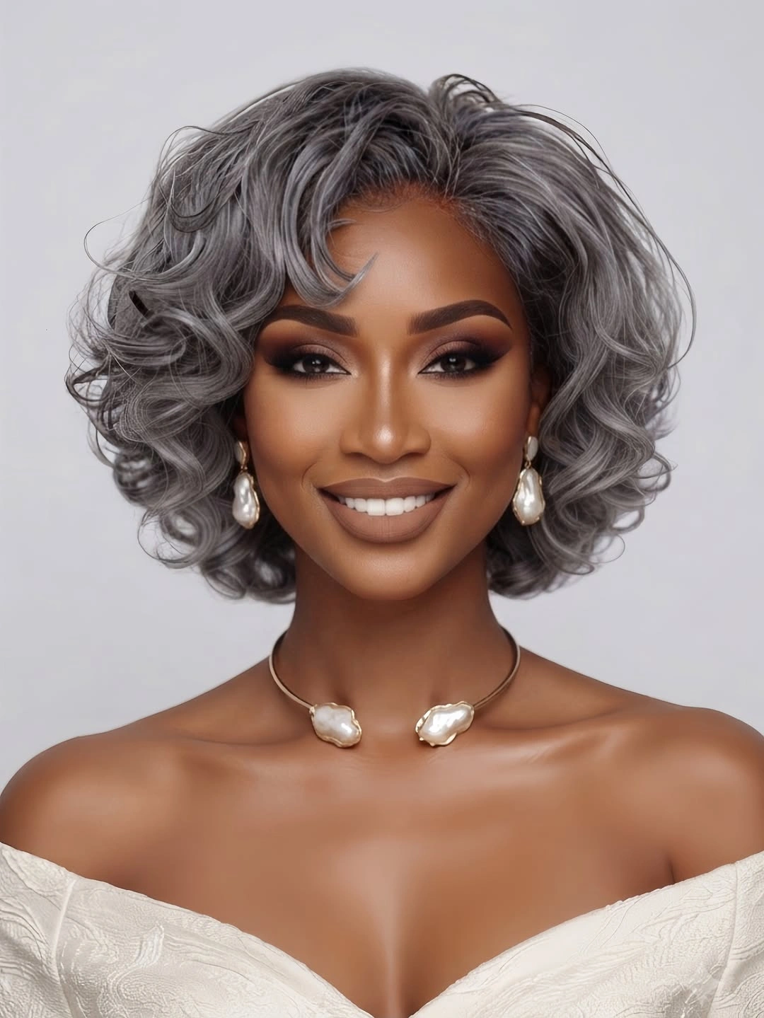 Short silver-gray curly bob with rounded sculpted waves