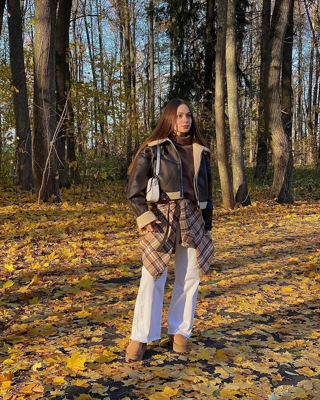 Brown jacket, plaid waist layer, white trousers, and tan shoes