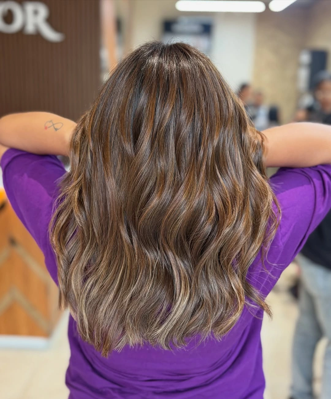Brunette waves with caramel bronze ribbons from the back