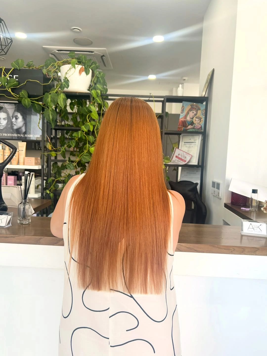 Very long straight copper-orange hair with blunt-looking ends