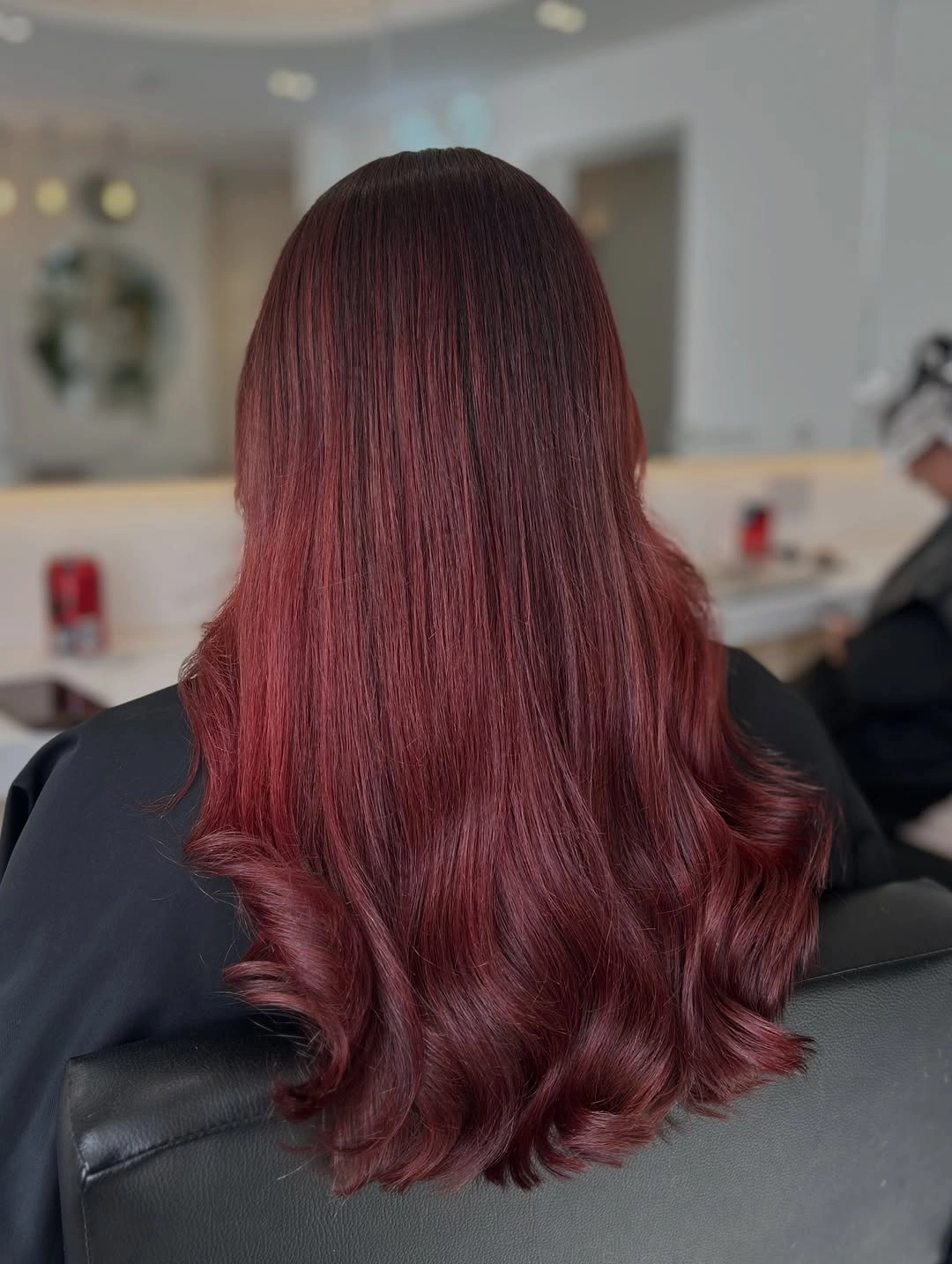 Long wine-red hair with smooth top and curled ends