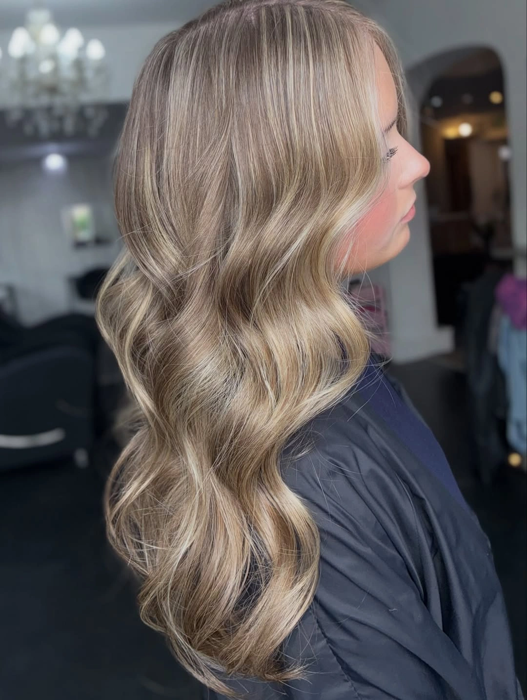 Cool beige blonde side waves with darker roots