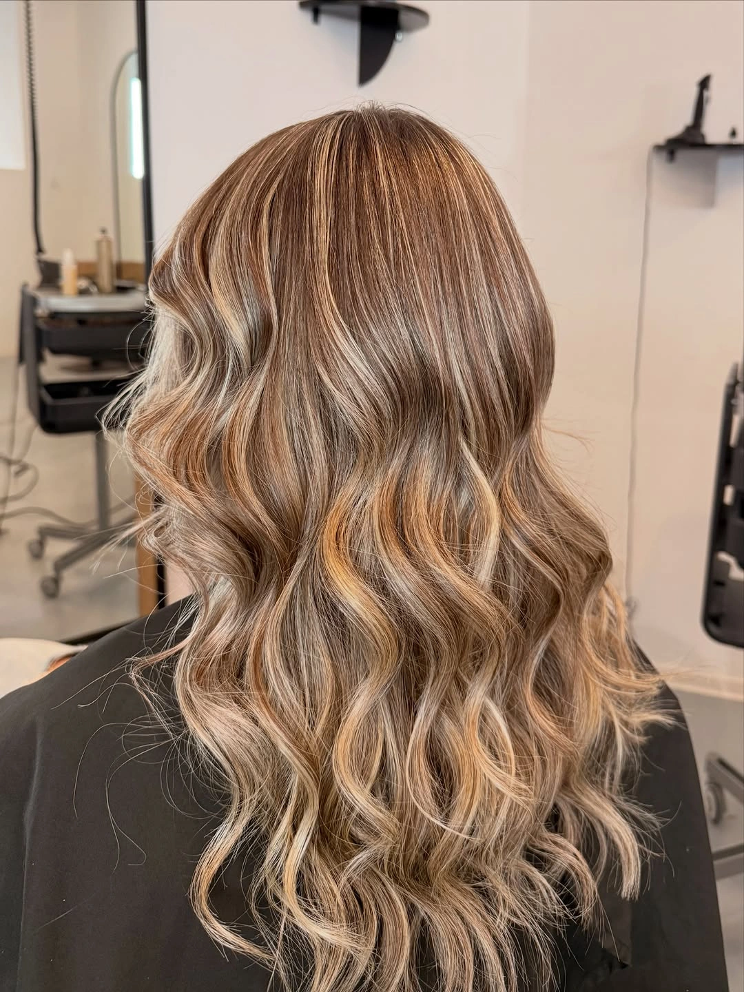 Warm bronde waves with darker base and beige ribbons