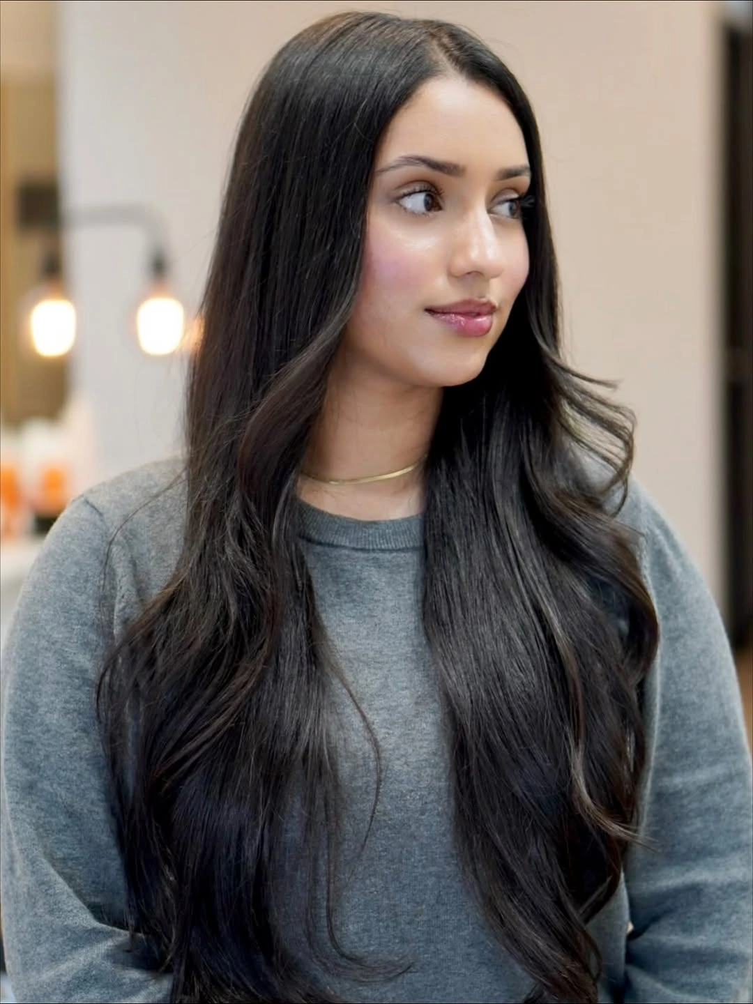 Long copper red waves with center part and face-framing layers