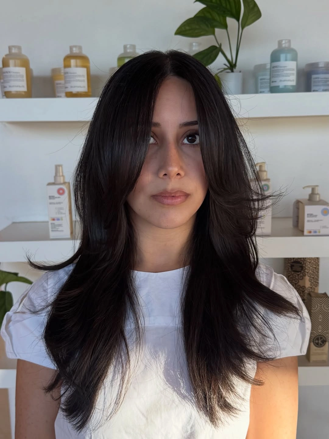 Long highlighted blonde waves with darker roots and layered front pieces