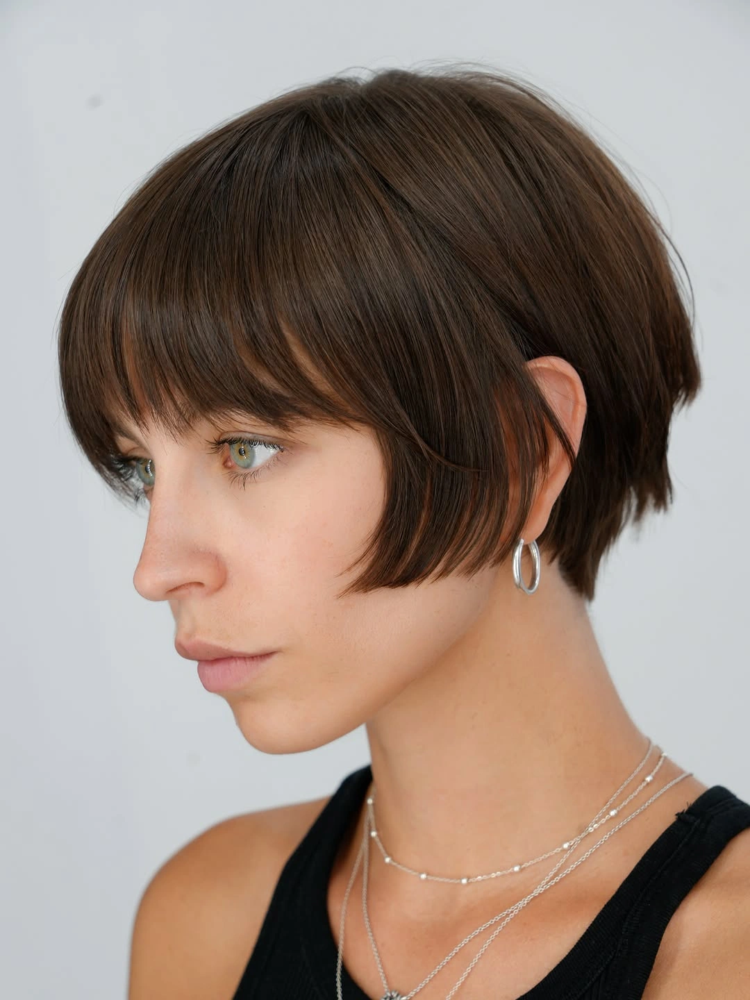 Long deep black layered waves with sweeping face-framing pieces