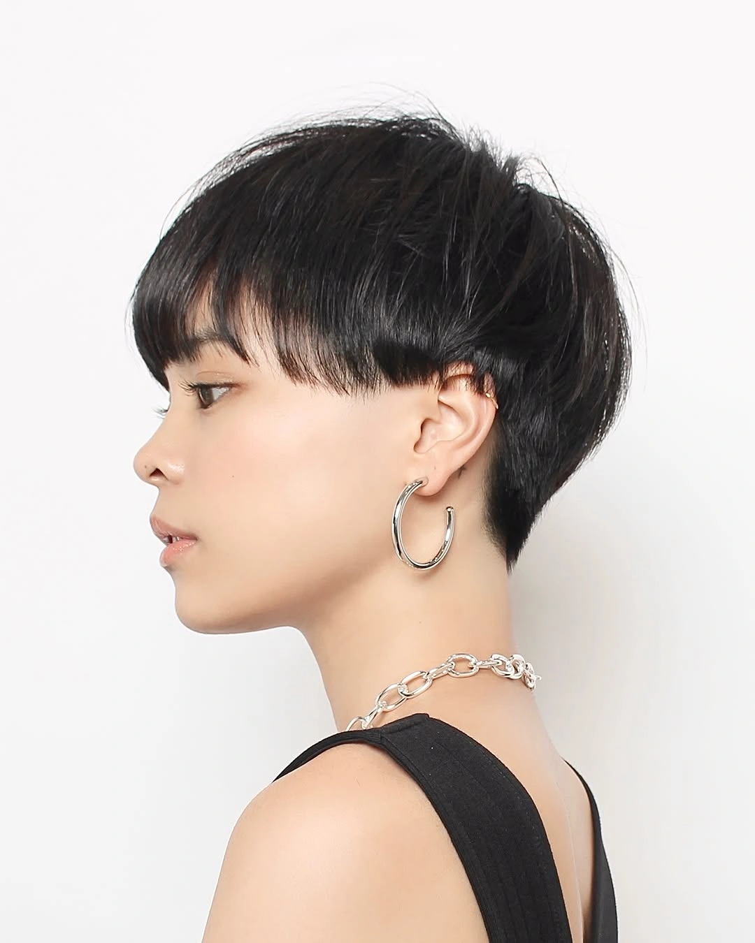 Short dark brunette rounded bob with soft curtain fringe