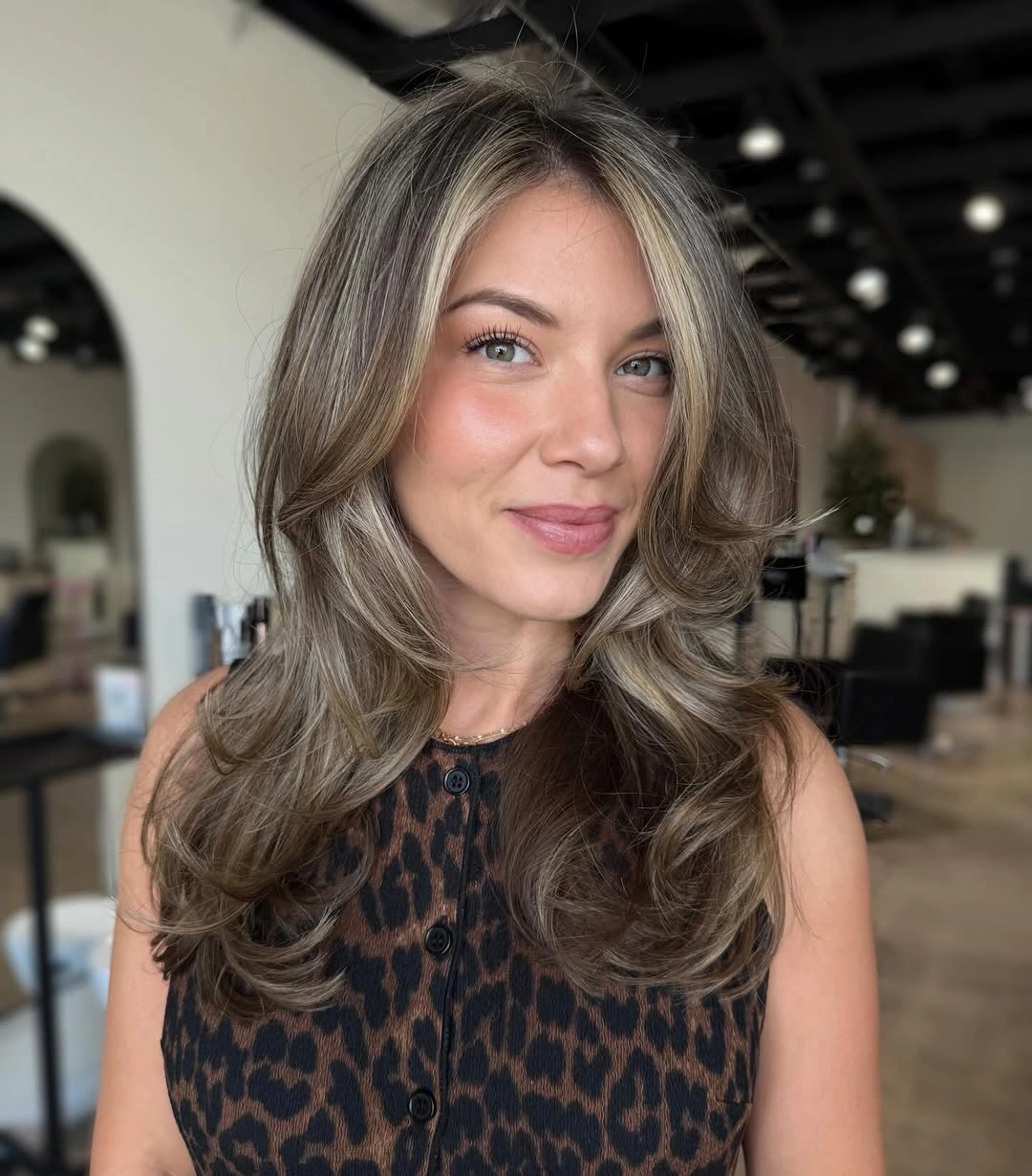 Shoulder length platinum blonde waves with fairly blunt ends
