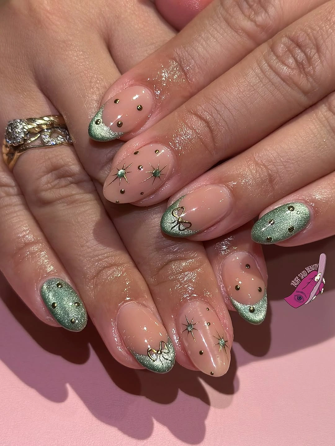 Almond nails with shimmery green tips dots and starbursts