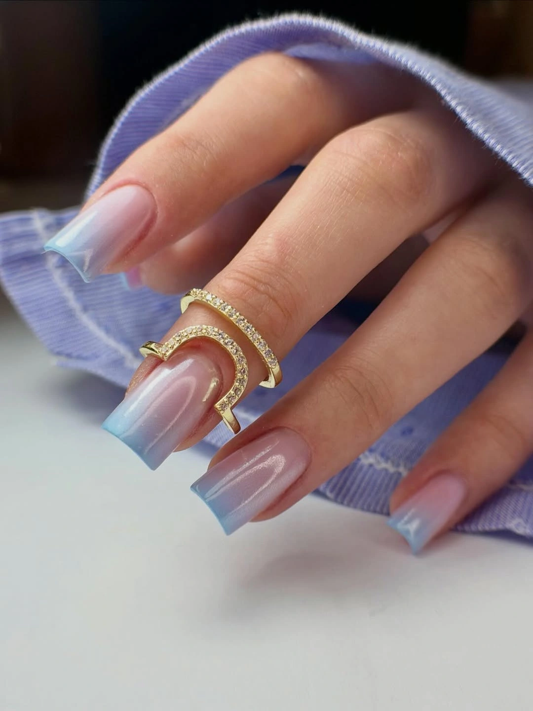 Long tapered-square nails with translucent pale blue tips
