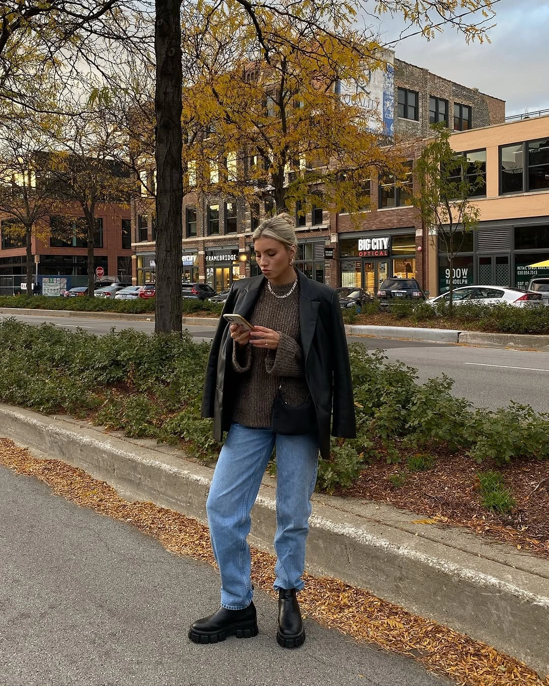Dark blazer, brown top, pale jeans, black chunky boots