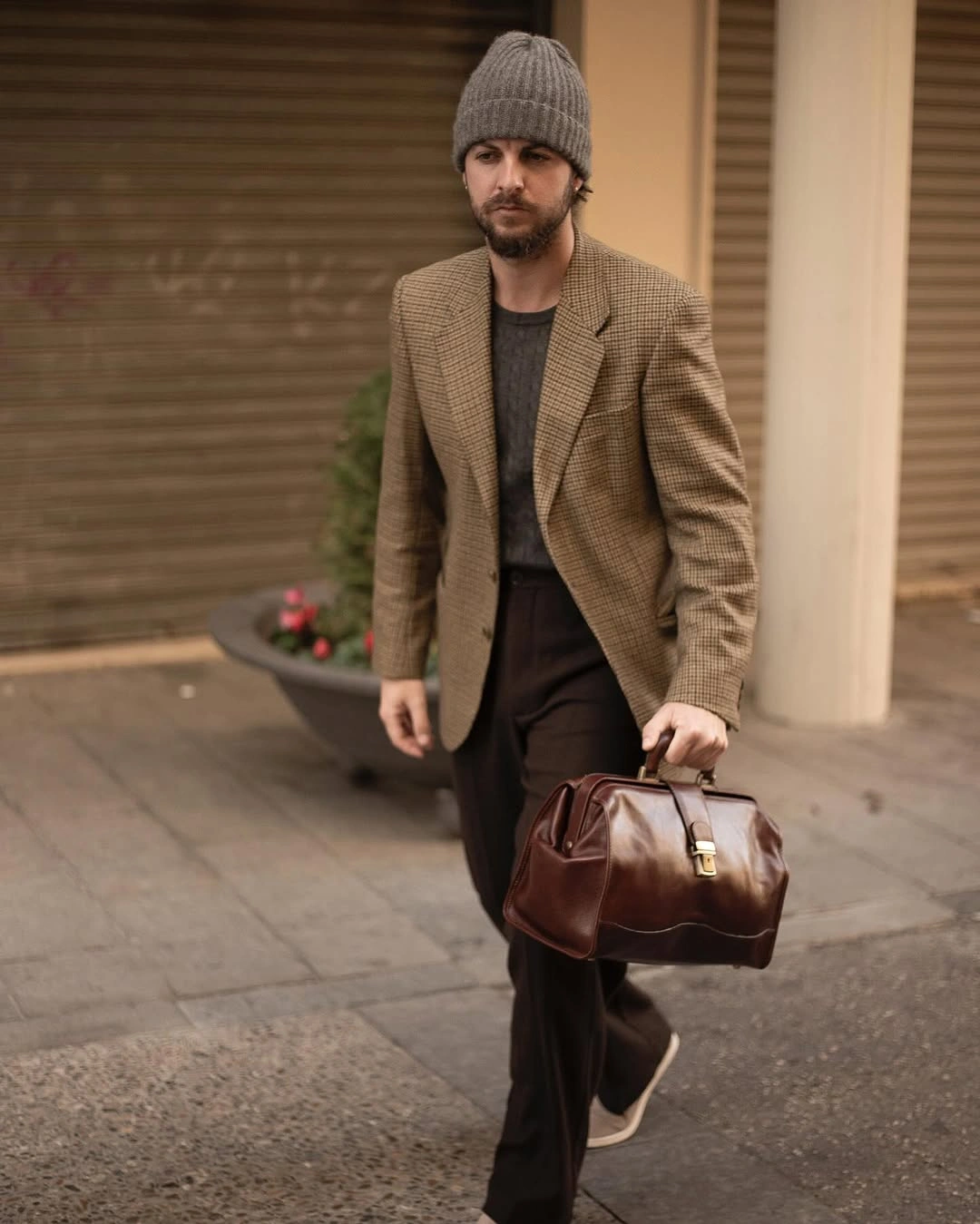 Tan checked blazer with brown trousers and beanie