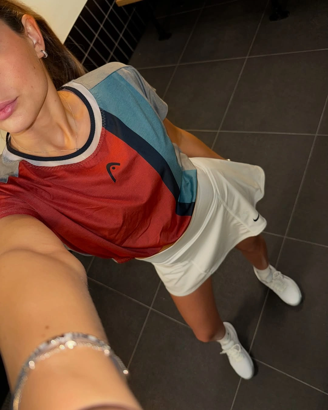 Red and navy color-block top with cream athletic shorts