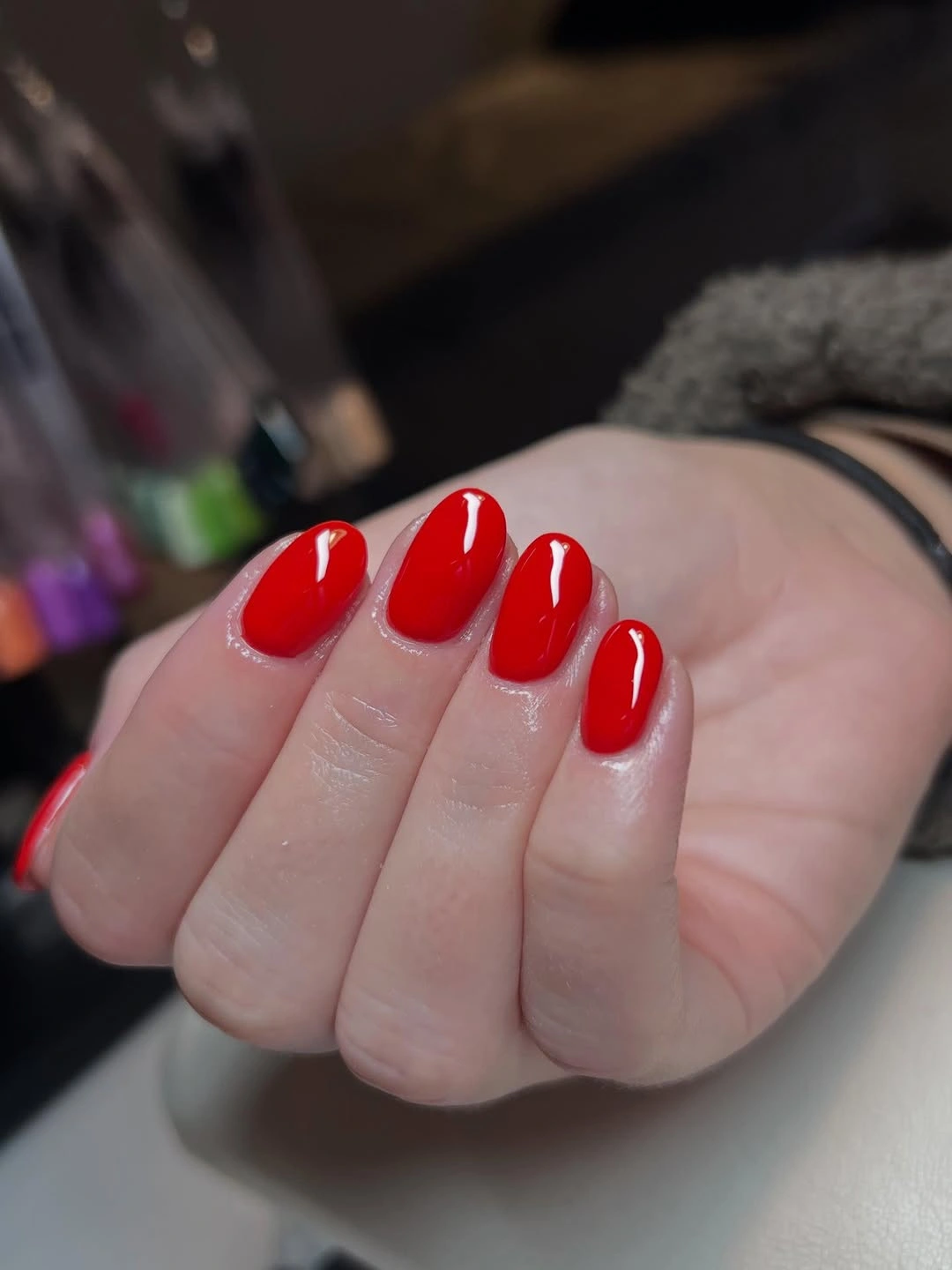 Short oval nails in vivid glossy bright red